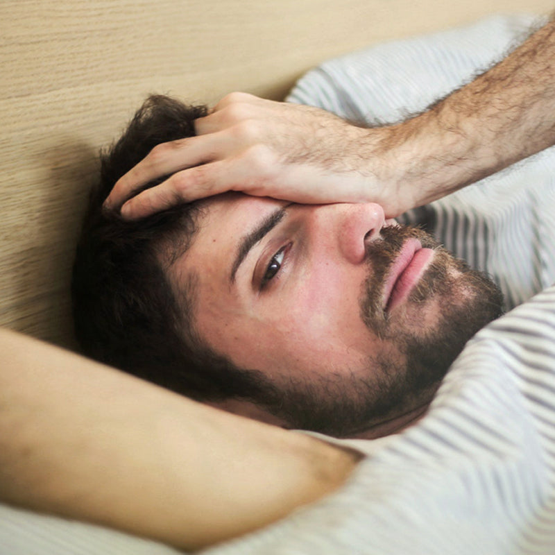 Man having trouble sleeping