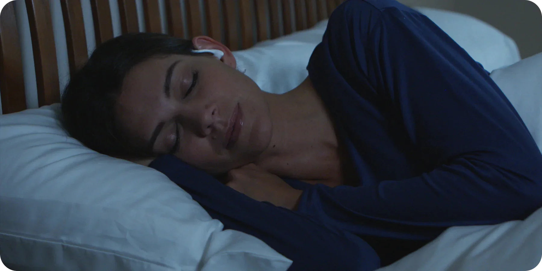 Girl sleeping wearing SoundOff Noise Masking Earbuds