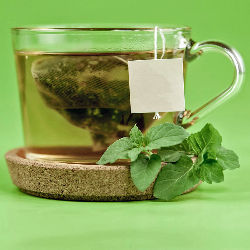 glass tea cup with tea in cup