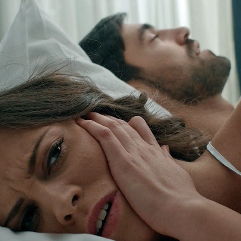 Man snoring in bed - girl can't sleep